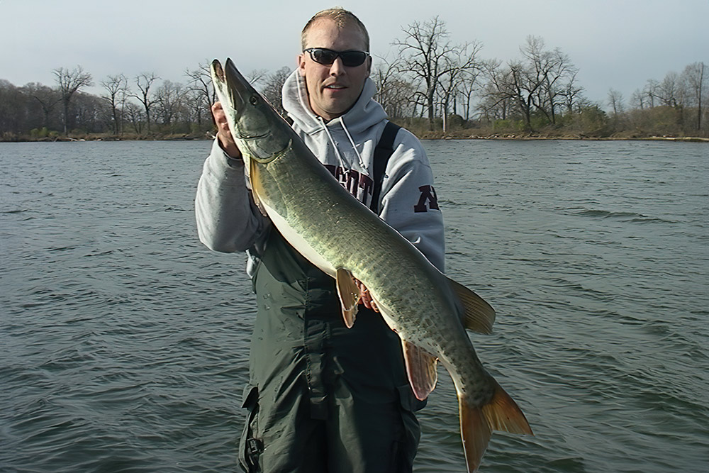 a man holding a fish